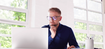 man looking at a computer